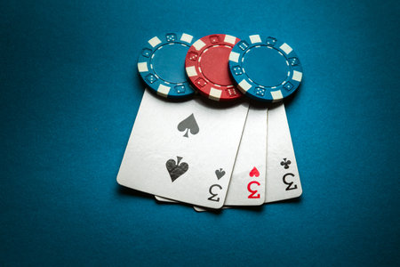A winning combination of three of a kind or set of cards on a poker table in a club. Successful...