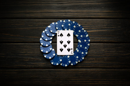 Predicting a big win with the seven of spades and blue chips on a black vintage strip in the club.