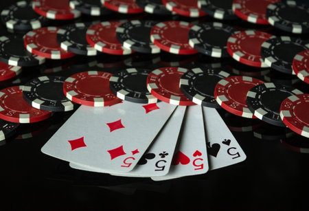Playing cards and chips received from winning or successful combination of four of a kind or quads....