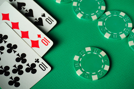 A poker composition with three playing cards, three of a kind or set, representing tens, and green...