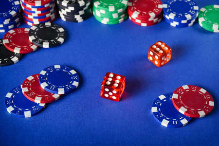 A game of Craps. Red dice lie among colorful chips. The atmosphere is lively, and the players are...