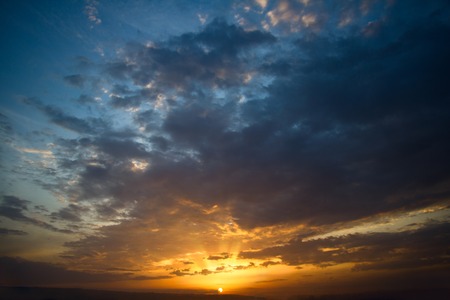 Dramatic sunset with clouds. Nature summer lightの写真素材