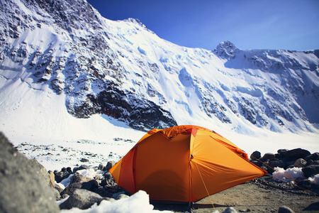 orange tent at the foot of the mountain, Beluha, Russiaの写真素材