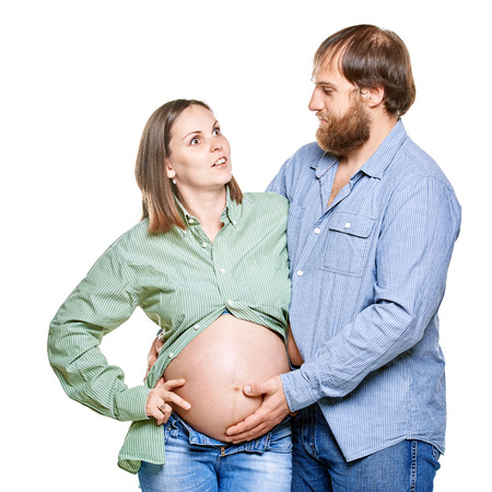 stout man with tummy and pregnant woman on a white background, isolated on a white backgroundの写真素材