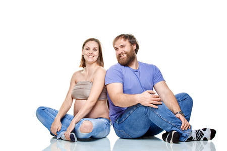 stout man  and pregnant woman on a white background, isolated on a white backgroundの写真素材