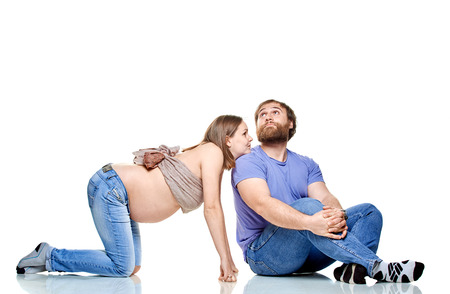 stout man  and pregnant woman on a white background, isolated on a white backgroundの写真素材