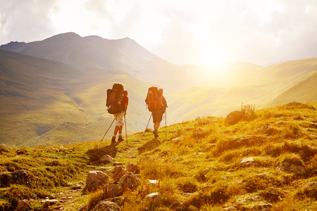 hikers on the trail in the Caucasian mountains. Trek to Kazbek mount