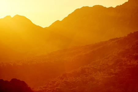Sunrise over valley with limestone mountains. focus foregroundの写真素材