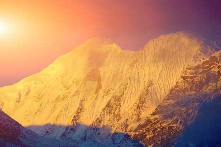 beautifull cloudy sunset in the mountains with snow ridge. Annapurna region, Himalayas, Nepal.の写真素材