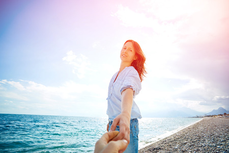 woman smiling  against blue sky looking at the camera. Turkey, Antalya.の写真素材