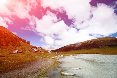 beautiful mountain lake at the foot of the mountain. Beluha mount region, Altay, Russia.の写真素材