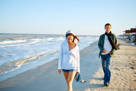 family on the beach at the  sunsetの写真素材