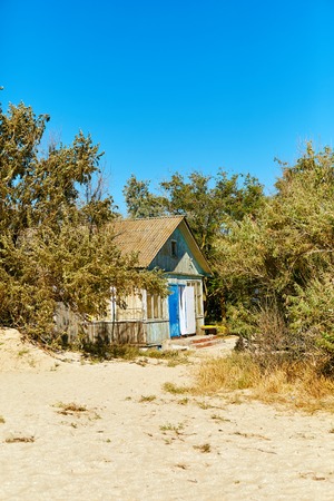 Wooden bungalow on the beach at the sunny dayの写真素材
