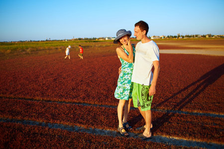 family in the field at the  sunset