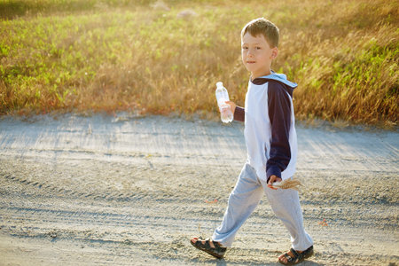 boy in the desert at the  sunsetの写真素材