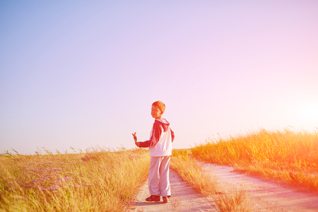 boy in the desert at the  sunsetの写真素材