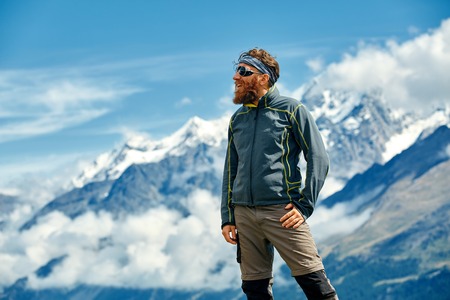 hiker at the top of a pass  enjoy sunny day in Alps. Switzerland, Trek near Matterhorn mount.の写真素材