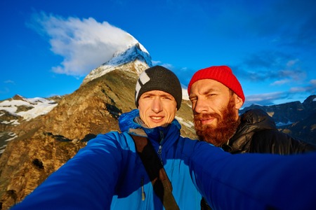 hikers  at the top of a pass  making selfie against  the Matterhorn mount, Switzerlandの写真素材