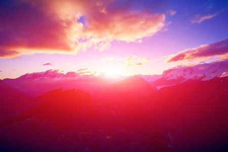 beautifull cloudy sunrise in the mountains with snow ridge. Alps. Switzerland, Trek near Matterhorn mount.の写真素材