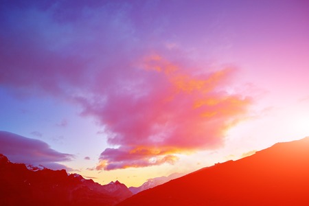 beautifull cloudy sunrise in the mountains with snow ridge. Alps. Switzerland, Trek near Matterhorn mount.の写真素材