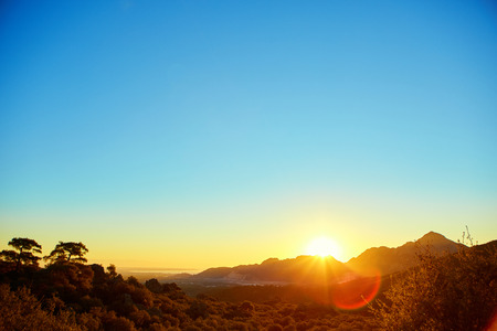 Sunrise over valley with limestone mountains. focus on middle groundの写真素材