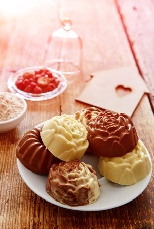 Dietary homemade cakes on a wooden background. cupcakes, cheese muffinsの写真素材