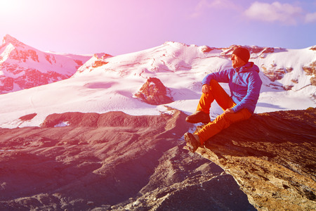hiker at the top of a pass with backpack enjoy sunny day in Alps. Switzerland, Trek near Matterhorn mount.の写真素材