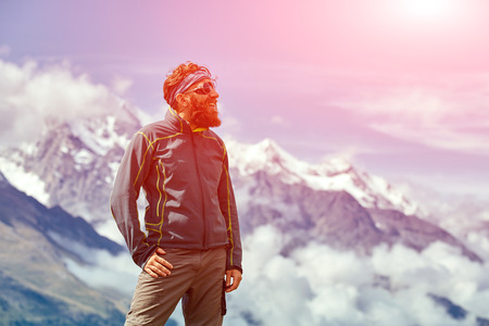 hiker at the top of a pass  enjoy sunny day in Alps. Switzerland, Trek near Matterhorn mount.の写真素材