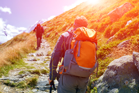 hikers with backpacks on the trail in the Apls mountains. Trek near Matterhorn mountの写真素材