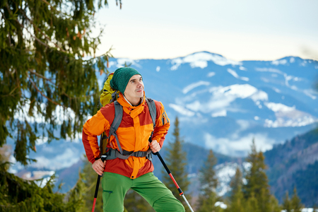 hiker with backpack on the trail in the Carpathians mountains at winterの写真素材