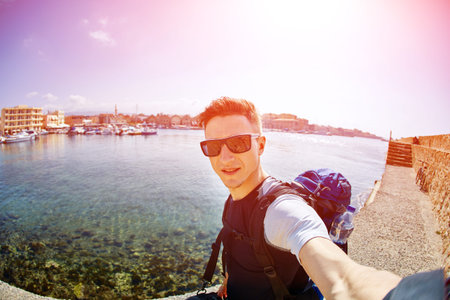 young man make selfie on the beachの写真素材