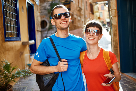 couple tourists  walking in the old townの写真素材