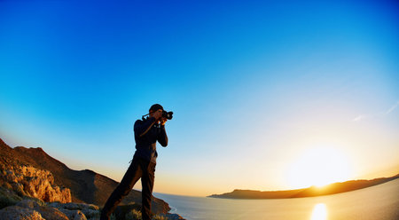 panoramic view on Balos beach, Crete, Greece. Man, traveller and photographer stands on the cliff...