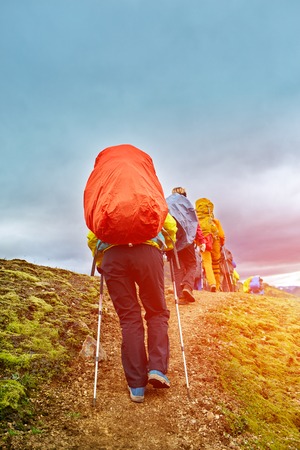hikers with backpacks on the trail in the mountains. Trek in Icelandの写真素材