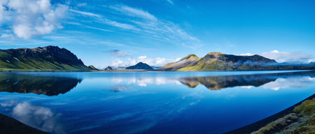 panoramic picture of Alftavatn Lake coast with mountain reflection at the sunrise, Iceland.の写真素材