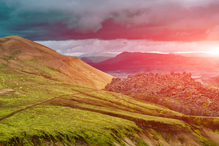 Valley National Park Landmannalaugar. On the gentle slopes of the mountains are snow fields and glaciers. Magnificent Iceland in the Augustの写真素材