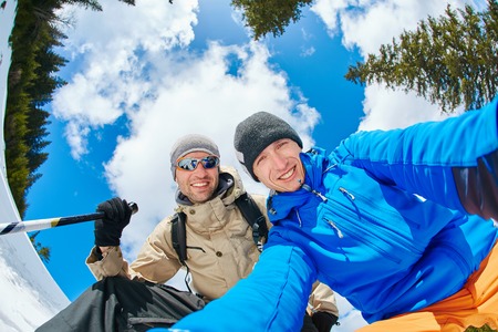 hikers make selfie in the winter mountainsの写真素材