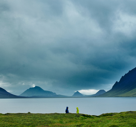 Lake coast with mountain reflection at the sunrise, Icelandの写真素材