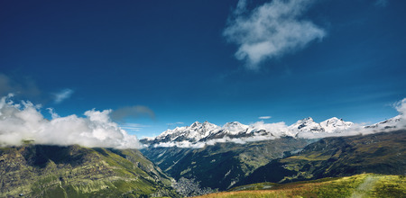 Snow capped mountains. Summits of the mountains. View of the Alpine mountains at the sunrise. Trek near Matterhorn mount.の写真素材