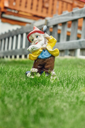figurine of a dwarf on the grass in the yard in Zermatt town, Switzerlandの写真素材