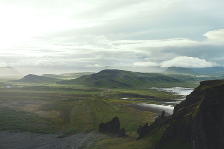 Rocks and clifs on Kirkjufjara black sand beach, southern Iceland.の写真素材