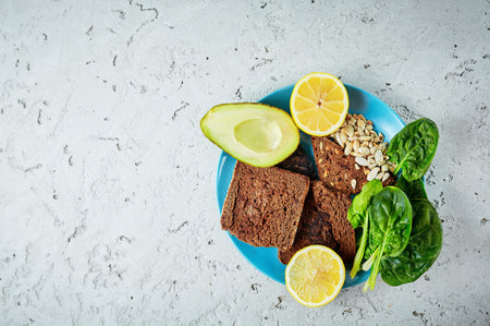 product set for vegan lunch on the blue dish on the concrete backdrop. Vegan healthy eatingの写真素材