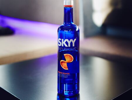 DNIPRO, UKRAINE - APR 30, 2018: Bottle of SKYY vodka on the black bar table in restaurantのeditorial素材