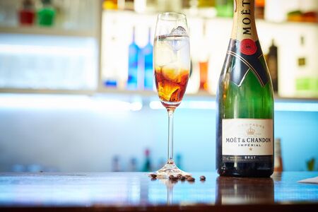 DNIPRO, UKRAINE - APR 30, 2018: Colorful cocktail with Moet Chandon champagne in glass on the bar table in restaurantのeditorial素材