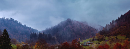 beautiful view of foggy autumn mountain landscape from the mountain village Dzembronya, Western Ukraine.の写真素材