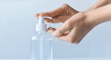 woman washing hands, using alcohol antiseptic gel prevent for germs, bacteria and virus. Clear sanitizer in pump bottle for hand hygiene corona virus protectionの写真素材