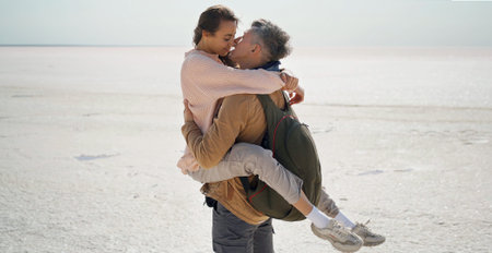 Traveler man holding and kissing his lover woman. Passion young couple on romantic travel honeymoon...