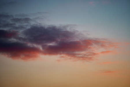Beautiful sunset sky with clouds, bright colors. Sky texture, abstract nature backgroundの写真素材