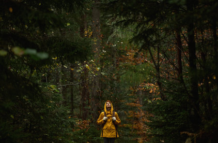 Woman hiker relaxing in green woods, dramatic cinematic panoramic picture of deep scenic moody...