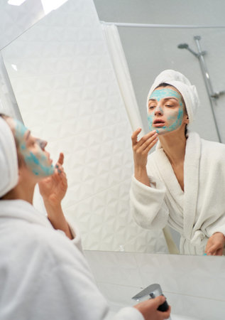 Female Beauty Portrait. Happy Multiethnic Woman Touching Natural, Healthy Skin, Using Cosmetic...